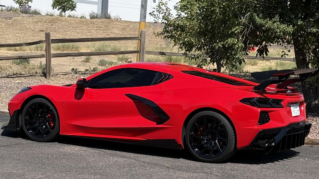 A rental car parked on a mountain road