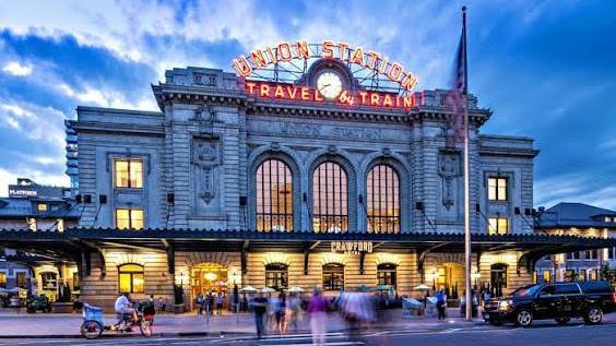 Denver Union Station lit up at dusk
